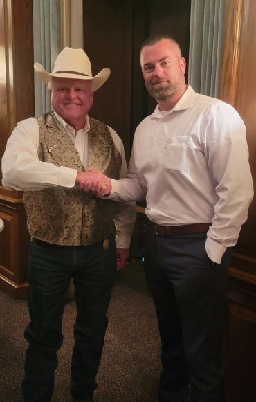 Mortgage professional handshake with client